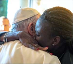 abraccio papa migrante